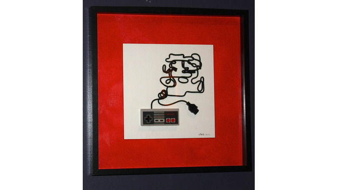 コントローラーのケーブルでゲームキャラクターを描いたアート作品